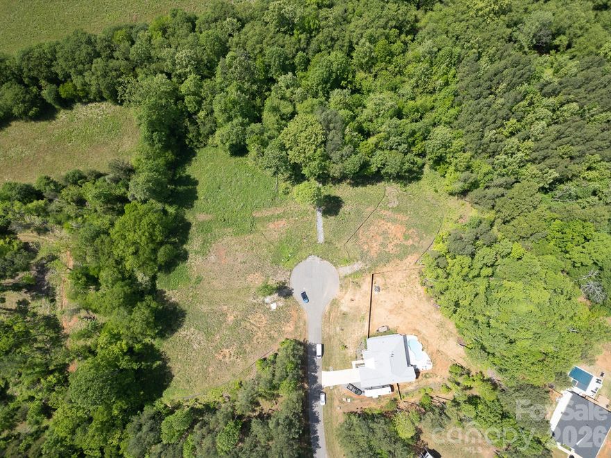 Build your dream home on this 1.94 Acre lot located on a quiet cul-de-sac within the Powder Spring Creek subdivision! Conveniently located near many amenities and I-77 providing easy access to Statesville, Mooresville, Lake Norman and Charlotte. The neighboring lots (125 Spring View Lane) is available! Septic permit, survey, and engineered house plans are available!