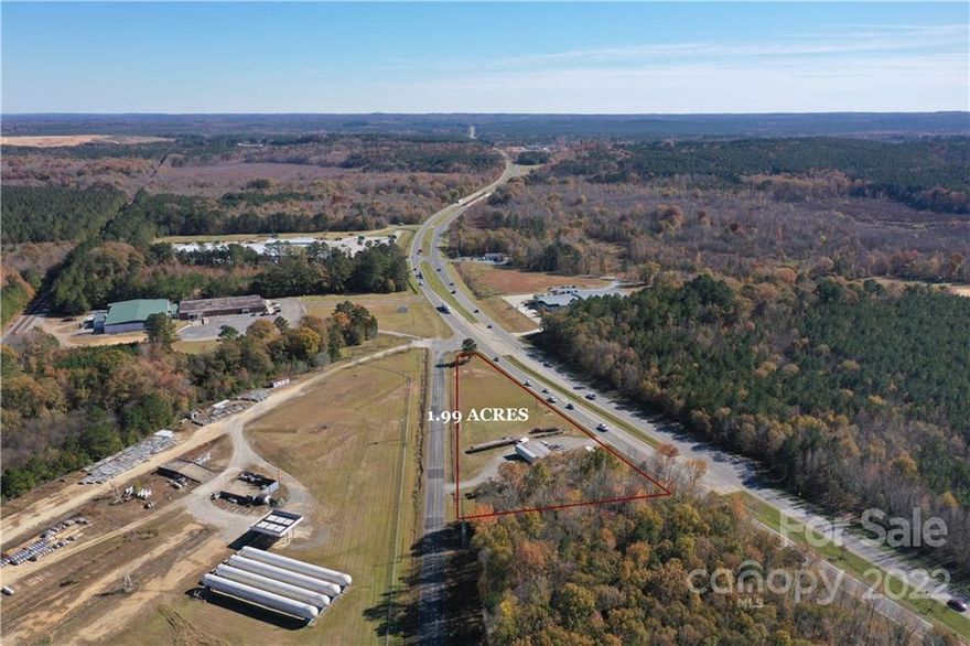 1.99 ACRES AND 627' FRONTAGE ON HWY 74 E PLUS PAVED CITY STREET FRONTAGE OF 662 FEET.
VISIBILITY FROM ALL AROUND!  HIGHWAY BUSINESS ZONING - OFFICE BUILDING ON THE LOT CURRENTLY is
40 x 20 (800 sf). with 1/2 bath offices or retail sales space.  Smaller 30' x 24' building with 1/2 bath.  Both buildings in good shape.  Month to month rentals now as a "Flee market"!
THIS LOT WOULD MAKE A GREAT COMMERCIAL LOT WITH ENTRANCES FROM HWY 74 & SMALL OLD HWY 74.  VERY CLOSE TURN AROUND DISTANCE.  BEST HWY SITE IN THIS AREA AVAILABLE LOT FOR CUSTOM BUILD DAIRY QUEEN, FAST FOODS OR SERVICE STATION. NEAR COUMMUNITY COLLEDGE, PEACHLAND/POLKTON ELEMENTARY AND BROWN CREEK ANIMAL HOSPITAL!