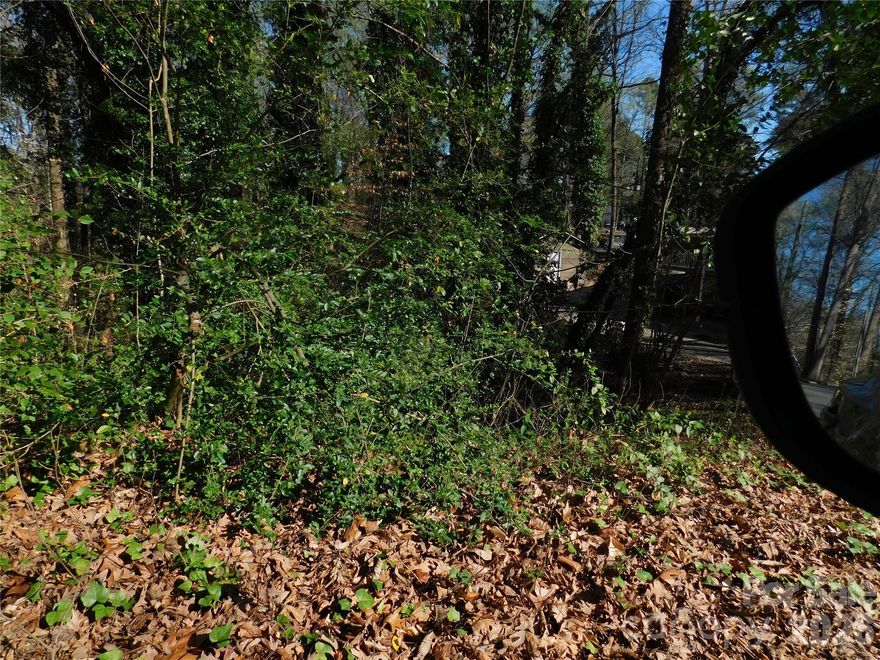 City lot off of Todd St. This lot drops off and is sloped and will require improvement to build. They had a buyer who was building a basement house. However that fell through. We have obtained the survey . Please do all investigation before contract purchase. It asks on the MLS minimum square feet to build. Called the planning and zoning for Concord. She stated they do not have minimum they have set backs. The set backs are 25' in the front and rear and 10' on each side.