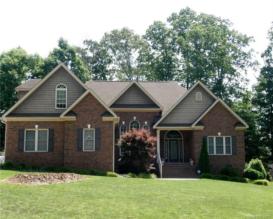 Fabulous 1 level living w/large bonus/4th BR & bath up + extra storage. Striking architectural features inside the home including very attractive arches.  Inviting great room has soaring ceilings and overlooks private backyard. All brick, low maintenance home w/granite counters throughout, hardwoods & lovely kitchen. Beautiful master has tray ceiling & large Master Bath w/separate tub & shower. Rear patio with landscaped yard is perfect for relaxing or entertaining.