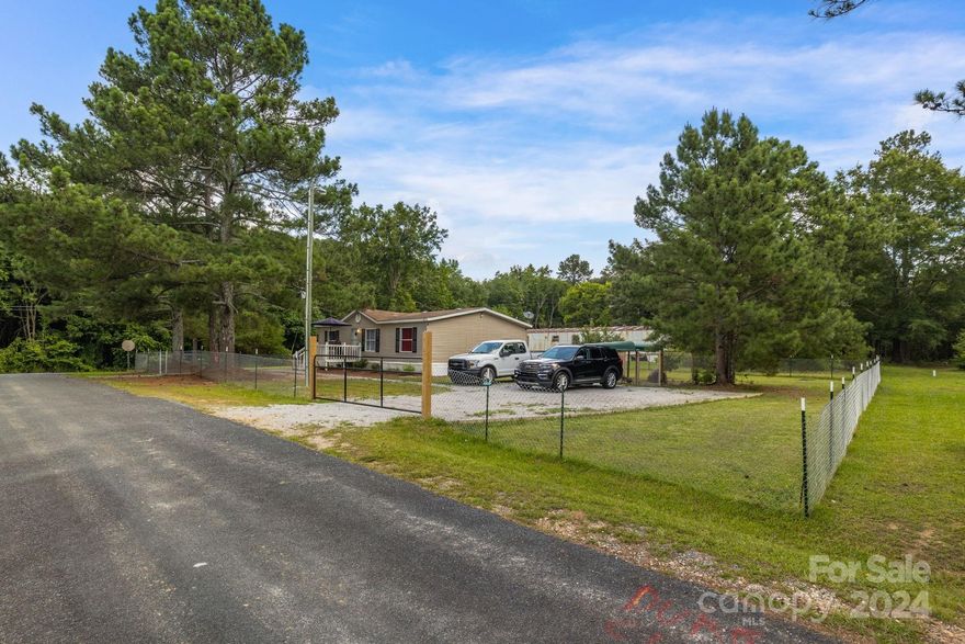 Discover the perfect blend of country serenity and city convenience with this delightful home. Step inside to find spacious bedrooms with ample closet space and a large family room, ideal for all your entertaining needs. The primary suite features an en-suite bathroom and a generous walk-in closet. This home is perfectly situated near the charming towns of Wadesboro, Norwood, Oakboro, Albemarle, Monroe, and Midland. Schedule your showing today to view this adorable home!