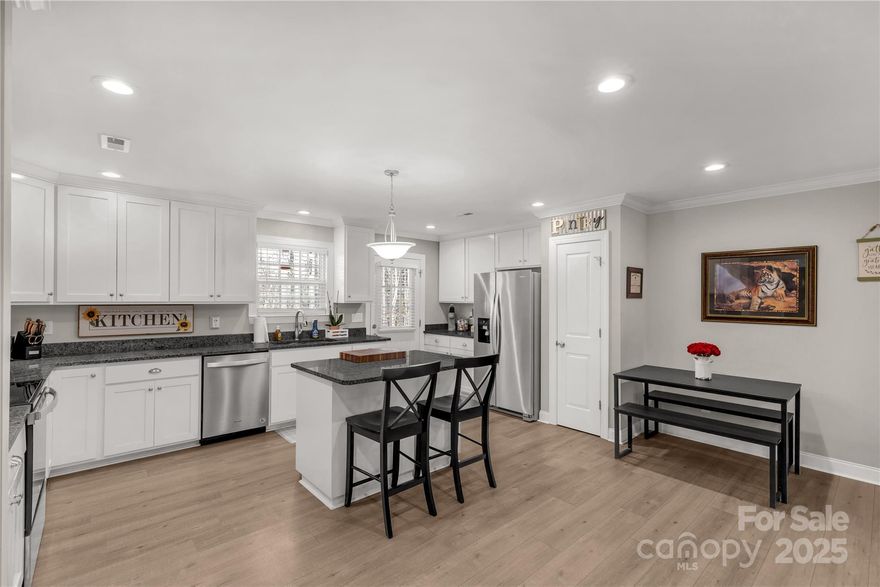 Welcome to this stunning three-bedroom, two-bathroom home, built in 2021, offering modern design and high-end finishes. Situated on half an acre, cornerish lot, this home features an open-concept layout with a split floor plan. With a beautifully designed kitchen, complete with granite countertops, stainless steel appliances, a spacious island, and custom cabinetry offering ample storage. The kitchen seamlessly flows into the dining and living areas, making it perfect for entertaining. The spacious primary suite features an en-suite bathroom with double vanity, while two additional bedrooms provide plenty of space for family or guests. Outside, enjoy your own private backyard hot tub oasis, perfect for relaxing. An attached two-car garage also provides convenience and additional storage. With its modern amenities, high-end finishes, and ideal layout, this home is a must-see. Motivated seller - Bring us an offer!