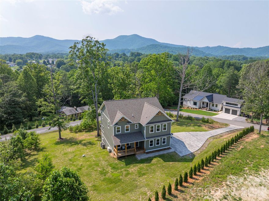 17 Baxter Woods Lane | Candler, NC 28715

If you’ve been searching for a modern mountain home near Asheville with long-range views, a finished basement, and space to spread out, this one checks every box.

Built in 2023, this custom home in Candler, NC sits on 1.24 private acres in the desirable Baxter Woods community, offering over 4,000 square feet of thoughtfully designed living space. With 4 bedrooms, 4 bathrooms, a walk-out basement, and a 2-car garage, it blends luxury finishes with everyday functionality.

The open floor plan is exactly what today’s buyers are looking for — light-filled living spaces, high ceilings, and a seamless flow between the living room, dining area, and gourmet kitchen with large island and walk-in pantry. Whether you’re hosting friends, working from home, or enjoying a quiet mountain morning, the layout just works.

The primary suite on the main level feels like a retreat, complete with a spa-style bathroom and oversized walk-in closet. A dedicated home office provides flexibility for remote work or study.

Downstairs, the finished walk-out basement adds serious value and versatility. With an additional bedroom, full bathroom, kitchenette, and expansive flex space, it’s ideal for a guest suite, in-law suite, multi-generational living, home gym, media room, or potential short-term rental setup (STR allowed).

Step outside and you’ll understand what makes this home special — private wooded setting, mountain views, and peaceful surroundings, all just minutes to downtown Asheville, shopping, dining, and I-40 access.

Please visit the property website at https://adeptmedia.hd.pics/17-Baxter-Woods-Ln/idx
Explore Baxter Woods here: https://youtu.be/2RuoG_0iT5Q