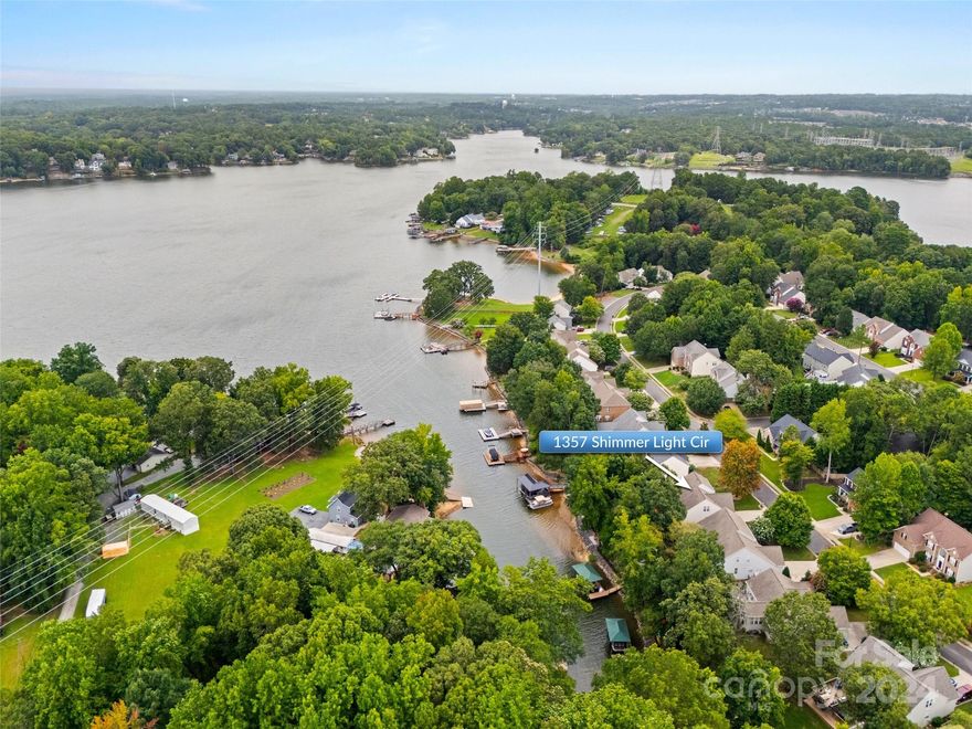 This waterfront home on Lake Wylie is the perfect retreat for those seeking peace and tranquility. Enjoy beautiful sunsets from the large expansive deck featuring a sunken hot tub and outdoor kitchen. The house has an open floorplan with vaulted ceilings and a wall of windows. The kitchen features granite countertops, a 5-burner gas stove with a double oven and an extended area with a wine fridge. The primary bedroom is on the main level with a door to the deck. Upstairs, there are two additional bedrooms, a newly remodeled bathroom with a walk-in shower and a large bonus room. There is a deeded boat slip in a gated area, just off the pier in the common area about a block away. 

Neighborhood amenities include a pool overlooking the lake, boat storage, a beach, and a picnic area.