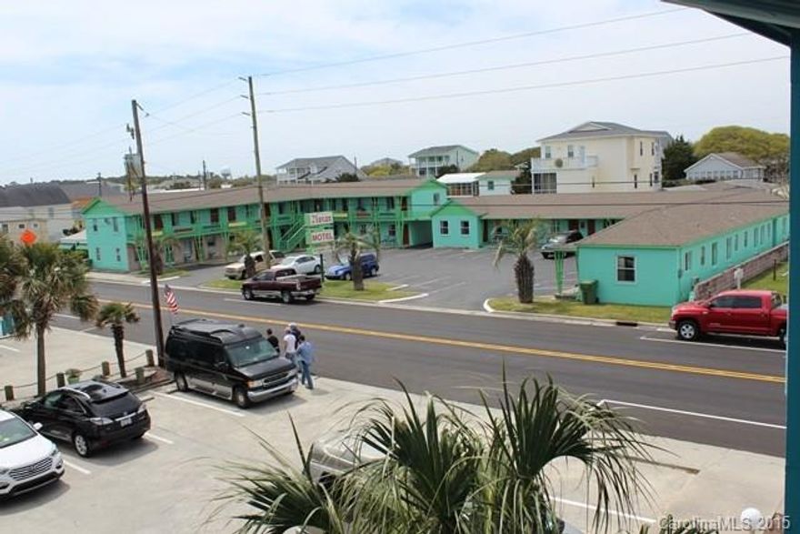 Investors' dream at Kure Beach.  Historic Moran Motel with 23 units, additional apartment; laundry facility as well as separate cottage located on corner of S. Fort Fisher & Avenue J.  Additional vacant lots adjoining rental buildings for future expansion and parking for boats & trailers.  Located in the historical district with public beach access across the street; within walking distance of restaurants, pier, etc.  Swimming pool for guests. Call for private showing.