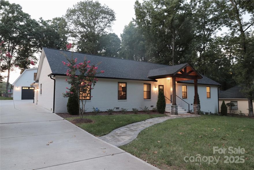 Where timeless charm meets modern luxury—this 4BR/3BA Cotswold ranch stuns inside and out. Fully renovated with new electrical, new plumbing, new critical systems, new oversized garage, and structural changes to create open-concept living. Gorgeous primary suite. Finely appointed home with chef’s kitchen (Thor appliances, waterfall quartz island, wine storage) and a spa-style primary suite. Jack & Jill bedrooms, a guest suite, and a flexible study offer space for every need. Step outside on your 2/3 of an acre lush, manicured backyard with pergola, outdoor kitchen, fire pit, and room for a pool/oasis. Detached garage loft is heated/cooled—ideal for office, gym, or guest suite (water and sewer adjacent to create ADU). Smart home tech, whole-house filtration, custom shades, irrigation. Zoned for top-rated schools: Cotswold Elem, Alexander Graham MS, Myers Park HS. Prime location—minutes to SouthPark, Uptown, dining, parks, and CLT airport. Rare opportunity—schedule your private showing today!