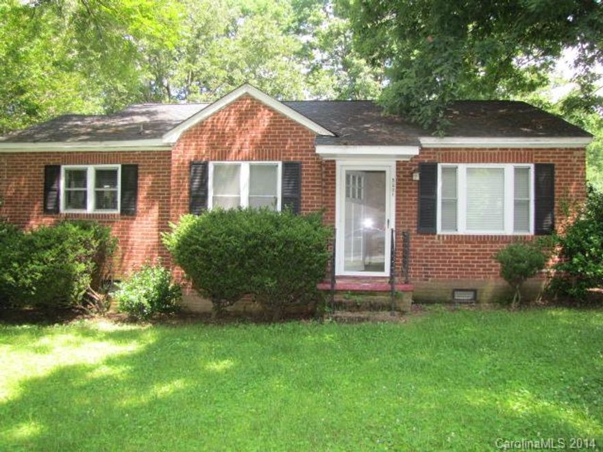 This is an adorable 2-bedroom, 1-bathroom full brick home on a great lot! There are hardwood floors throughout the main level. The living room/dining room is a nice, open space with a fireplace. Both bedrooms are a good size and share a full bathroom with pedestal sink. The kitchen has all the major appliances. The laundry area is under the carport with lots of storage space. Just a mile or so from I-85 this home is very convenient for commuting in and out of Charlotte.