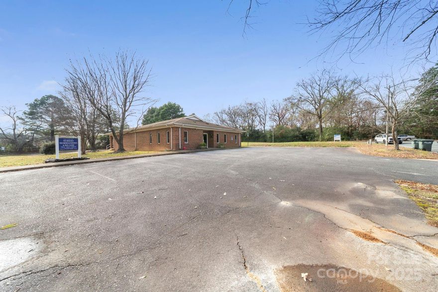 Location! across the street from Atrium Health Carolina's Medical Center/Monroe.  Set up for Doctor's office with Large reception and waiting rooms, 6 exam rooms, 3 offices, kitchen, 2 storage rooms.  Plenty of parking in Front and Rear for employees.   All equipment and furniture is negotiable.