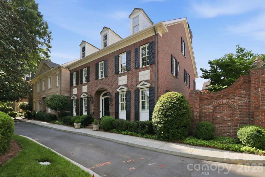 Set on one of Myers Park’s most iconic corners—Queens Road and Selwyn Avenue—this beautifully appointed townhome-style condo in Stephens Square offers refined living with the ease of a lock-and-leave lifestyle.

Inside, generous living spaces unfold with a large family room anchored by custom built-ins, seamlessly opening to a private, brick wall–enclosed outdoor retreat—an ideal extension of the home for everyday living and entertaining. The well-appointed kitchen offers ample workspace and storage, and the rest of the main level is thoughtfully laid out with a study/living room, dining room, and dedicated office space, providing flexibility for both work and relaxation.

Upstairs, the primary suite is a true sanctuary—easily accessible via elevator—creating comfort and convenience for all stages of life. Two additional bedrooms, each with en-suite baths, offer privacy and space for family or guests.

A rare and charming bonus, the separate outbuilding- presents endless possibilities—perfect as a studio, potting shed, or additional storage. Completing the home is a two-car attached garage and the security and exclusivity of a gated community.

An exceptional opportunity to enjoy timeless style and low-maintenance living in one of Charlotte’s most coveted locations.