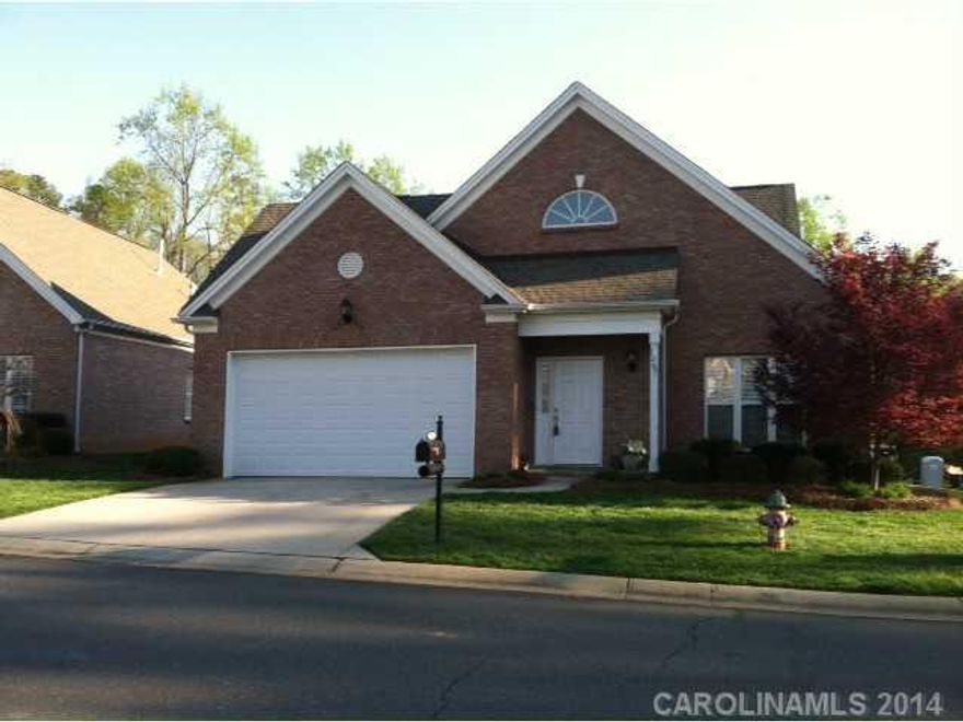 Great location. Close to medical and shopping. Never cut grass again! Only $185.00 per quarter takes care of it all. Irrigation system. Large two car garage. Possible expansion in walk-in attic. Ready to finish. New ceramic tile floor in master bath. Hardwood floors. Custom upgrades include fireplace with gas logs, built in bookshelves and double sink vanity in master bath. Must see to appreciate!