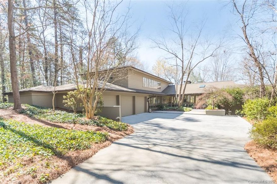 Come home to a classic waterfront home w/basement in gated community. Perfectly maintained. Open spaces on main floor, large deck, & gorgeous views, perfect place for relaxing & entertaining. Lots of windows. Large kitchen w/imported granite, SieMatic cabinets, Gaggenau cooktops. Master on main. Large rec room, media room and workshop area (4th car garage) in basement. Also: 2 fireplaces, lots of built-ins/storage, Screened Porch, Dock, Deep water. Award-winning Clover schools, low SC taxes.