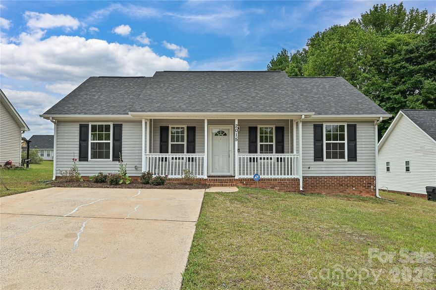 Established Neighborhood. Modern Feel.
2015 Slater Springs Dr is a charming single-family home situated at the entry of a quiet cul-de-sac in an established Charlotte neighborhood, surrounded by mature trees and a welcoming residential feel that's hard to find at this price point.

Inside, LVP flooring flows throughout, the kitchen features warm brown cabinetry, white countertops, and a full appliance package, and the primary bathroom impresses with a glass shower, soaking tub, and oversized vanity. A cozy fireplace and spacious backyard round out a comfortable, move-in ready layout.

Kennedy Branch Greenway, Fred Alexander Park, and Ribbonwalk Nature Preserve are all just nearby for outdoor adventures and quiet walks, while the Friendship Sportsplex and McCrorey YMCA offer fitness and recreation options right around the corner. ALDI and Food Lion keep everyday errands quick and convenient.
Quick access to both I-77 and I-85 puts Uptown Charlotte, NoDa, and everything the city has to offer within easy reach — making this an ideal location for buyers who want neighborhood calm without sacrificing city convenience.

A move-in ready home in a well-connected Charlotte community — don't let this one slip by.