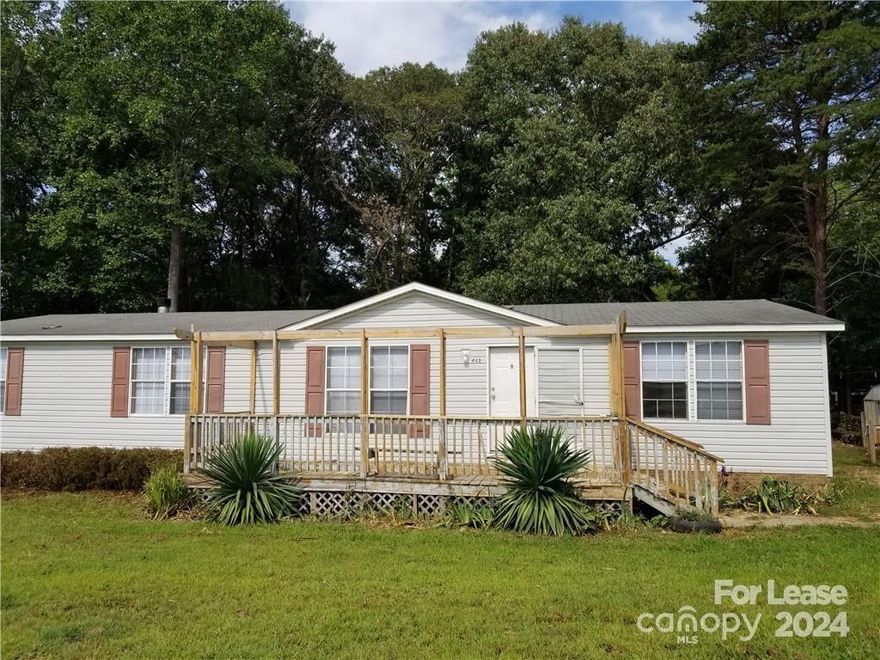 Cute home on large lot with mature trees, storage shed and tons of privacy. 3 bedroom/2 full baths. Large primary suite has bath with soaking tub. Kitchen opens to family room with fireplace. Separate den/living room. Front and rear decks. Convenient location.