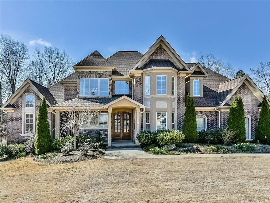 Enjoy SC Weather Year Round in Your Vaulted Screened Porch with fireplace and skylights! Beauty throughout: granite, tray ceilings, hardwoods, arches, millwork, walls of windows, 2 story foyer, vaulted GR. open staircase. Unfinished Basement ready for your finishing touches. Master with generous closet & Guest Suites on main. Chef's Kitchen & Butlers pantry. Covered Patio & Deck. Always hot water with tankless water heater. Irrigation, security & fire protection. Wooded back and lush lawn!