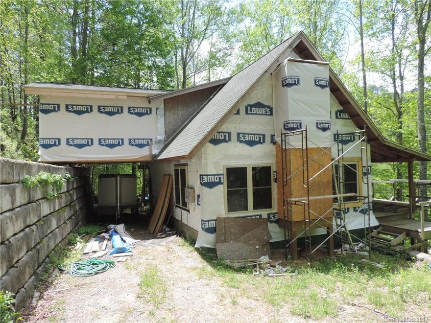 Home is Under Construction and being sold as is. Located right down from Cataloochee Ski Resort. Great potential for a vacation rental or vacation home or full time living. Vaulted ceilings in great room with fireplace, open living space on main floor with huge covered deck for entertaining. Master on second floor with huge space for master bath.Parapet off master. Full basement to finish the way you want too. Home is under construction and please be advised.