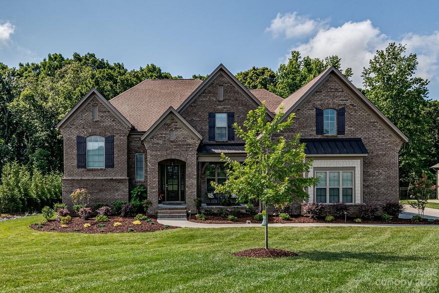 Beautiful home in sought-after community of Atherton. Space for all your needs in this 4-bed, 3 flex spaces, 3.5-bath home w/ open floor plan, great room w/ custom built-ins, gourmet kitchen w/ island, formal dining rooms. Owner's suite with sitting room on main level, luxury bath, walk-in closets. The three flex spaces are ideal for your home office(s), man-cave, gym, guest bedroom, and/or playrooms - one on lower level and two on upper level. Relax on the screened back porch overlooking a private and beautifully landscaped yard, patio with fireplace and grill bar.  4-car garage w/ epoxy floors  - room for all your vehicles and/or toys.  You're close to shops & dining in Waverly, Stonecrest, Ballantyne, and convenient to I-485. Zoned Weddington schools. Community pool, playground and walking trails.  Full interior pics to be posted NLT Aug 4. Showings begin Sat Aug 5