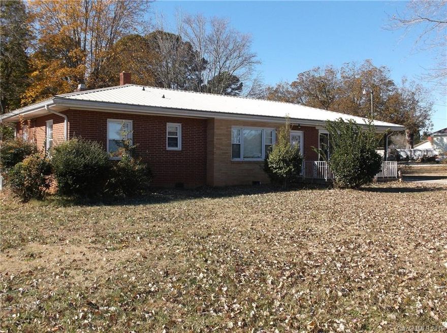 Fabulous brick 3-bedroom/2-bath home on 3.70 acres. Lovely original hardwood floors, den with fireplace, spacious kitchen, large workshop & detached garage. Well maintained. New roof 2015. Move-in-ready. ***SOLD-AS-IS***