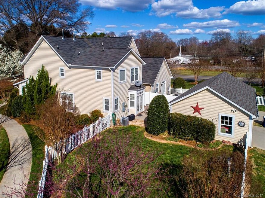 From the minute you pass through the picturesque courtyard and in through the magnificent front door, this home continues to impress.  This crafsman-style gem boasts wood floors, 42inch cabinets, granite counters, fireplace, new carpet, master suite, 2car garage, huge side lot and fenced yard.  Lots of window and bright lights with a highly functional layout make this home feel hundreds of square feet larger than it is! Downtown Huntersville and 485 are just minutes away! Lawn maint. included!
