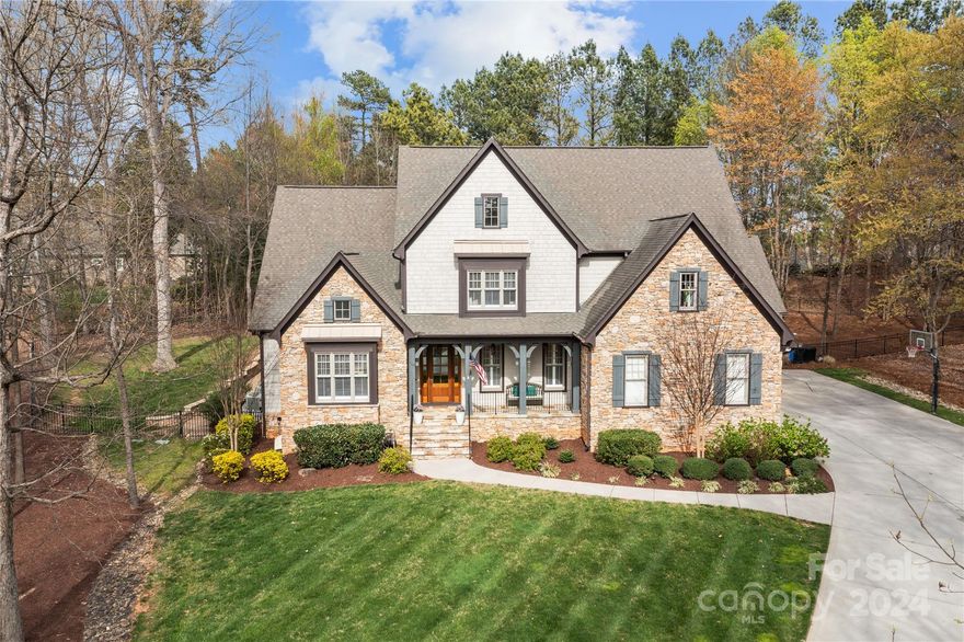 Nestled in the coveted Point neighborhood in Mooresville (AND w/a deeded boat slip),this home has beautiful curb appeal & architecture.Inside, you're greeted by a large foyer, formal dining room, office w/cathedral ceiling, butler's pantry, half bath, formal living room w/fireplace, built-ins, & coffered ceiling, keeping room w/floor-to-ceiling stone fireplace & built-ins.Prepare your meals in the gourmet kitchen w/gas range, hood, large center island w/snack bar & a huge built-in banquette.The primary bedroom suite is on the main level w/huge bathroom-separate vanities/closet space as well as a large tiled shower.Upstairs offers 3 bedrooms w/en-suites, a den, bonus room w/ 1/2 bath & loft space/game room.You'll love the spacious, open floor plan, & wood features throughout!The serene patio area has a covered patio, an outdoor fireplace & kitchen.This home offers a lifestyle...From the world-class amenities to the vibrant community spirit & conveniently located.It’s a must see today!