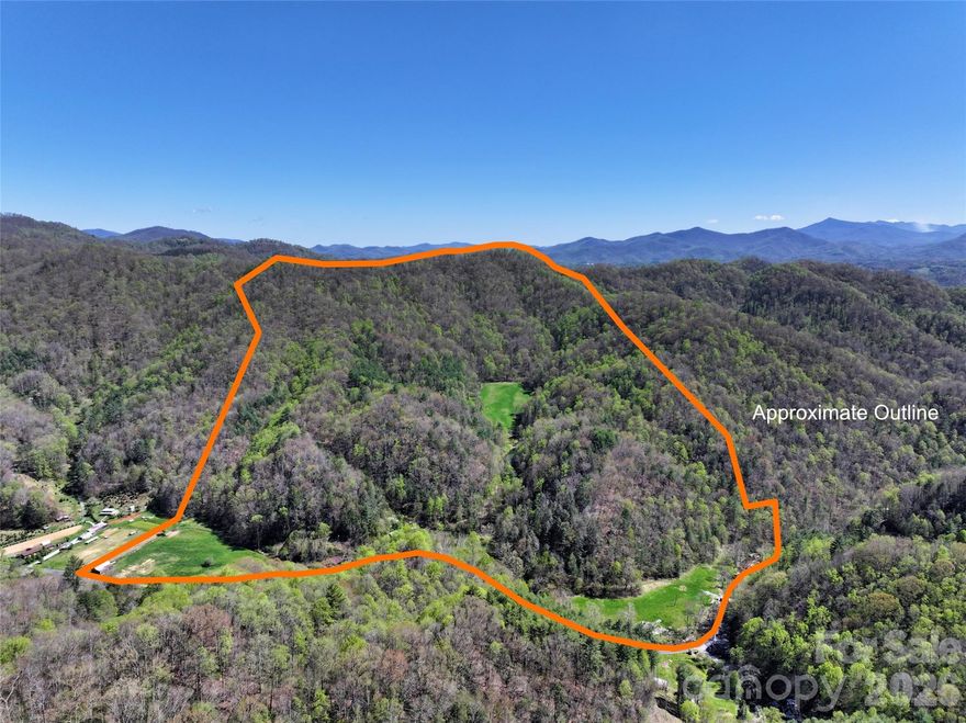 This UNRESTRICTED 138+/- acre parcel is ready to become your family compound or hunting estate, with plenty of good build spots for the whole family! Neither words nor pictures can do justice to the majestic serenity of this parcel. It has great mountain views, internal trails for ATVs, horses or hiking, a hidden meadow with big ridgeline views for your dream home, a four season creek, multiple springs, a big spring-fed pond and two flat pastures, all on a quiet dead-end paved road that also accesses thousands of  acres of Pisgah National Forest with many miles of trails and waterfalls.  Bring your hiking boots, dogs, horses or ATVs and explore the many interior trails on this unspoiled mountain gem. Enjoy the prolific wildlife, including trophy bucks and big sassy tom turkeys!  Pasture your livestock in lush flat pastures with old apple trees.  Enjoy ~1700 feet of frontage on pristine Pigeon Roost Creek.  Fish the creek for the native brook trout or stock the large springfed pond with your own personal supply. And if you want bigger adventures, the mighty Toe River and the Appalachian Trail are nearby.  If gardening is your passion, the land has not seen pesticides or other chemicals for decades -- come make the organic garden of your dreams in the rich soil!

The old farmhouse boasts a stunning structural and interior makeover and a huge new deck overlooking Pigeon Roost Creek. Enjoy morning coffee on your deck while a cheerful four season creek seranades you.  Come back out in the evening and marvel at the fireflies and countless stars in the dark night sky.  Live in this lovely renovated farmhouse while building your dream home in the hidden upper meadow -- it is ready for your builders, with a new, heavy-duty bridge and an interior access road already in place.  

If ecotourism is your aim, this lovely parcel would be a great place for a barndominium and any number of satellite lodgings for guests.  

The owner is HIGHLY MOTIVATED to sell and will convey at no cost a deluxe Polaris General 4 seater UTV, two ATVs, deluxe new deer blinds and even a bulldozer for your ongoing trail development or landscaping needs.  Bonus:  the lovely new designer furniture in the renovated farmhouse also will convey!

You can feel worlds away in this special place, but all the modern conveniences are close at hand.  For restaurants, groceries, galleries and shops, the quaint town of Burnsville, NC is close by, while Asheville, NC or Johnson City, TN are an hour or so away. 

Check out the drone video at https://www.youtube.com/watch?v=tGsN_ZOsd0o