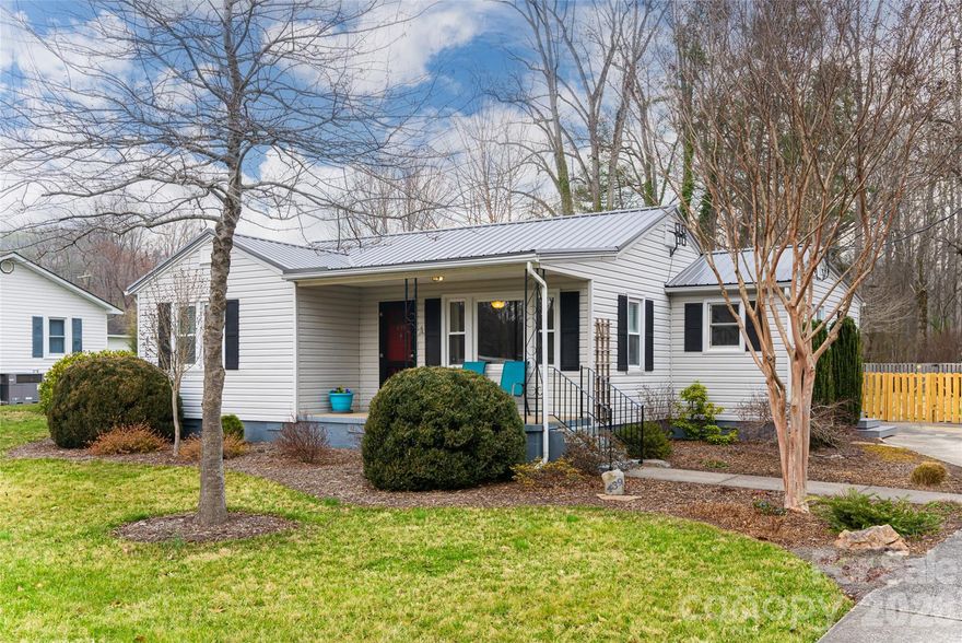 Location location!! Here is your chance to own an adorable and affordable well-loved home in the desirable town of Brevard. You will love being just steps away from the Brevard rec path (and Ecusta Brewery) and a few minutes from Pisgah Forest hiking, biking and fishing. Close proximity to shopping, dining, more breweries, Brevard College and downtown Brevard too. Enjoy the fenced and level backyard with a charming deck, garden, workshop/storage building, and even a pump track for the avid mountain bikers. Stay cozy and warm in the winter relaxing in the little sitting room with woodstove and cool in the summertime on the covered front porch or back deck. The owners have made many useful improvements to the home.They remodeled the kitchen with tasteful updates including stainless steel appliances, granite counters and gas range. Other improvements include a 2024 metal roof, new carpet, and fresh interior paint. Check out the convenient mud room with gas tankless hot water heater and washer and dryer that convey with the home. Easy access to all of Brevard's many amenities and attractions.