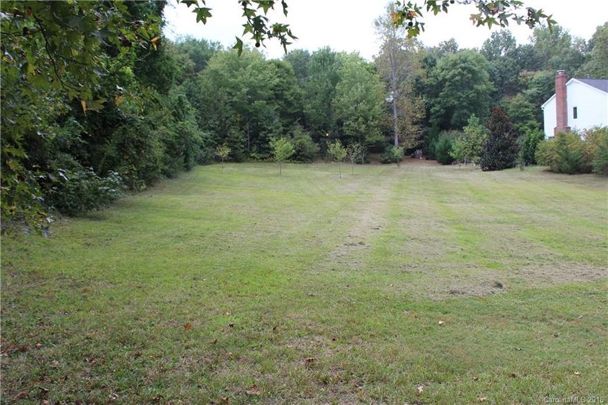 PRICE REDUCED! $1400 reduction effective October 20th.  Start building your home in this wonderful neighborhood today.

Rare opportunity to build the home of your dreams in an established neighborhood.  Easy access to 485 - Rocky River Road, I-77, I-85 hospitals and UNC-Charlotte.  Property will be minutes from the new Lynx light rail.  Easy to build mostly cleared lot with lovely maple trees in the back yard.  City Water and Sewer are available at the street.
