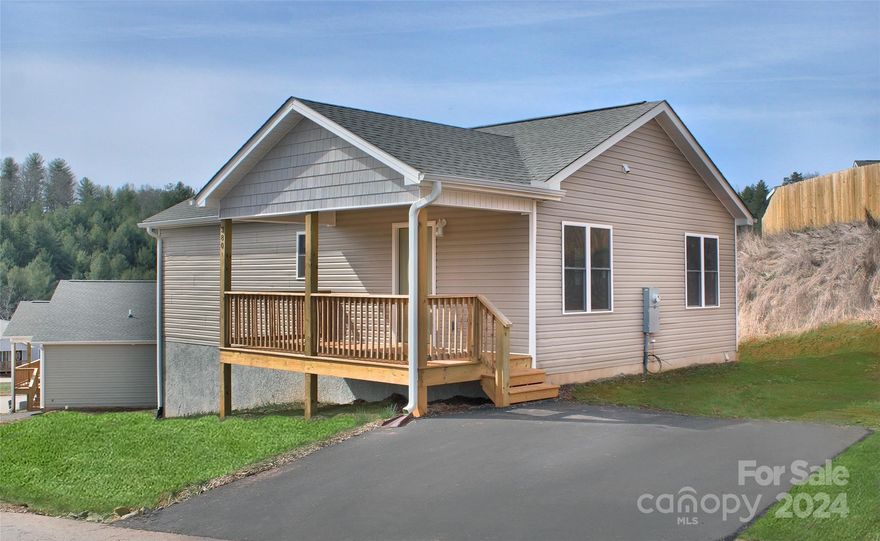 Huge square footage for the price.  Escape the traffic come be a part of small town life just 20 minutes to downtown Asheville. New construction in  conveniently located new home community in Mars Hill. This site built plan offers primary bedroom suite on main level, seperate living area in the fully finished basement with 2 bedrooms, (1 downstairs bedroom does not have a closet), full bath and a large living area, luxury waterproof vinyl plank flooring throughout, granite counter tops, stainless appliances, 2x6 exterior walls.  The community offers paved roads, green space, high speed fiber optic internet service and all city services, including water,/sewer, free trash pickup and free curbside recycling.  Close to schools, restaurants shopping.  Taxes to be determined. Photos representative