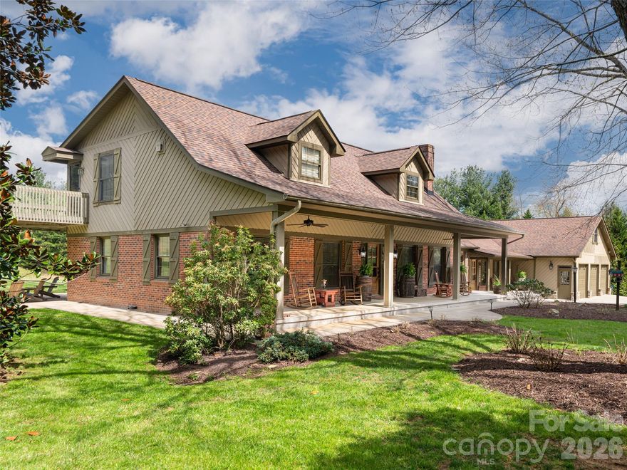 Set on 10 private acres with breathtaking year-round 360° mountain views, this expansive Candler estate offers a rare blend of space, flexibility, and lifestyle. Originally built in 1973 with thoughtful additions over time, the home features 5 bedrooms and 4 bathrooms, including an upper-level primary suite with an updated ensuite bath and generous closet space. Bring your cars and ATV's, the home boasts a 9 car garage with ample storage above for all your holiday and entertaining decor. Multiple outdoor living areas provide ideal settings for dining, entertaining, or simply taking in the surrounding natural beauty. With no HOA and the potential for income-producing opportunities, this property offers versatility for a variety of uses. Ideally located off Hwy 151 with direct access to the Blue Ridge Parkway, just 7 miles to grocery shopping, 9 miles to the nearest brewery, 11 miles to the Asheville Outlets on Brevard Rd, and 16 miles to downtown Asheville. Come see all this property has to offer.