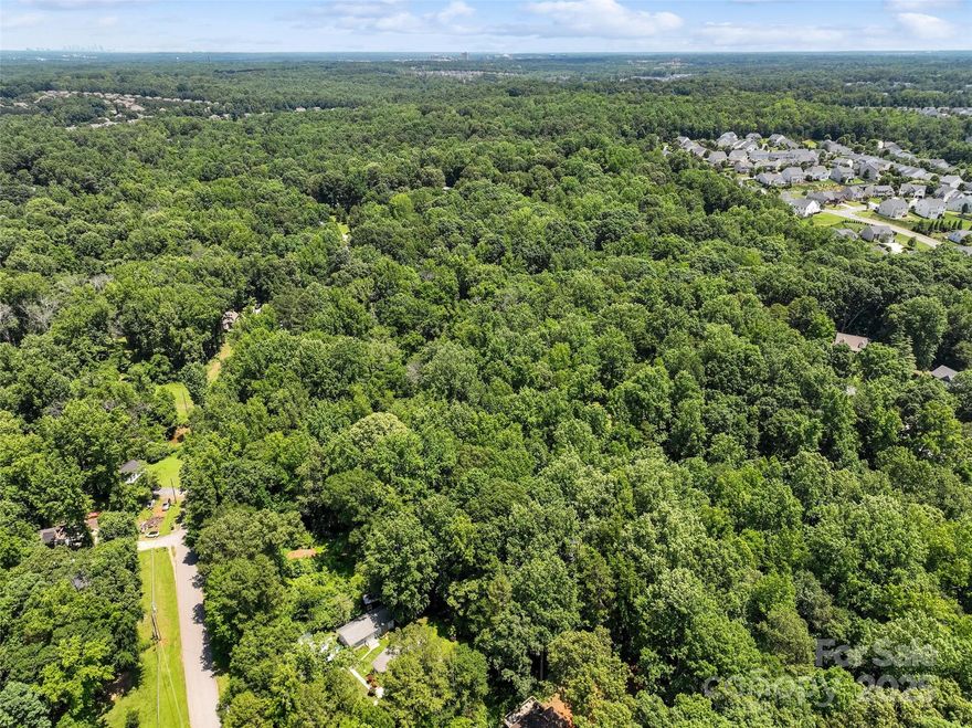Big lot. Great location. Endless potential. All just outside Ballantyne. 

3.61 acres with nearly 200 feet of road frontage and quick access to I-485—this one’s all about space and convenience. 

With Clems Branch Creek along the back edge, the property has a quiet, tucked-away feel. Per seller, well, septic, and city sewer have been installed—buyer to verify all. Whether you're thinking long-term investment or just want a slice of land with some serious appeal, this one’s worth a look.