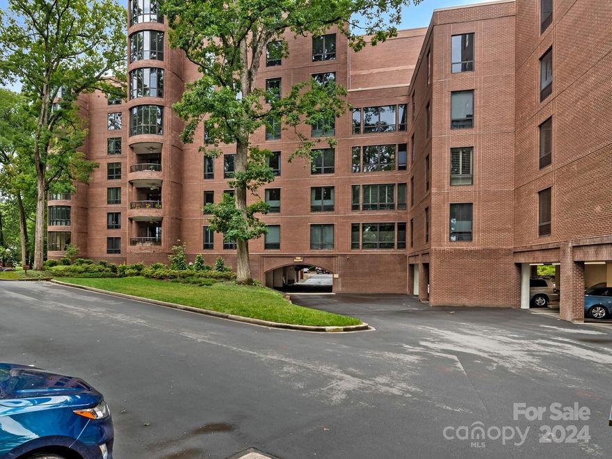 Back on market after buyers terminated due to personal reasons. This is your second chance to acquire a light-filled, gracious condo in the heart of Eastover. Located on the top floor of its area of the building, this comfortable floor plan affords a perfect blend of open living space and privacy. Hardwood floors flow throughout beautifully decorated spaces as large windows offer views of Charlotte's premier neighborhood and a canopy of mature trees. Living is easy and quiet in this steel and concrete building. All kitchen appliances (with the exception of the wall oven) are less than a year old. Multiple closets feature custom shelving and ample storage. A generously sized storage unit with built-in shelving is conveniently located on the same floor. Few condominiums in Charlotte offer this combination of location, parking, a pool and club room, and expansive grounds. HOA dues include Spectrum cable and internet, gas, water, part-time security guard, and part-time sited management.