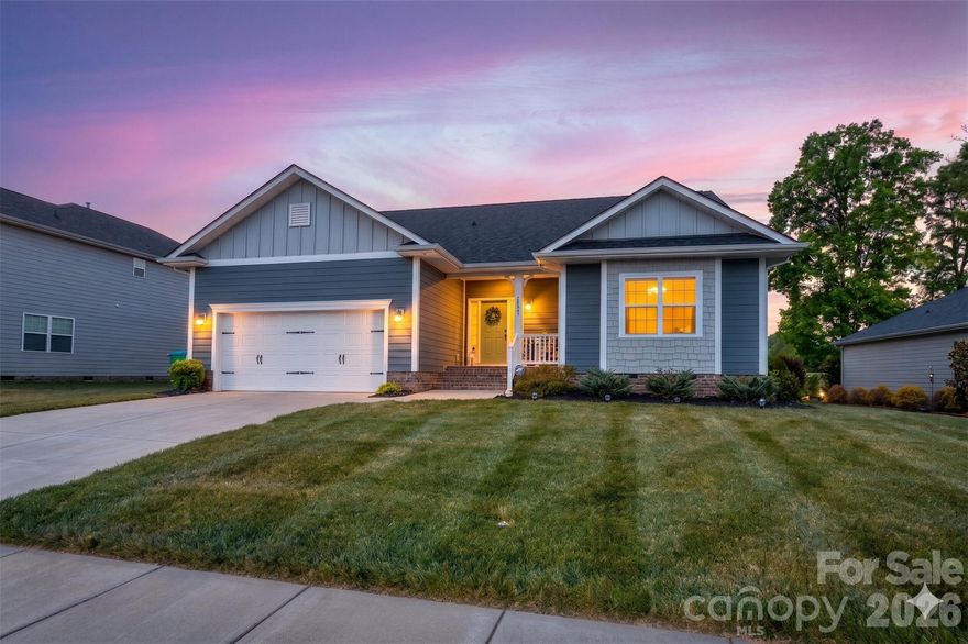 This one is special!  One of the best views of the golf course, it overlooks the 2nd hole.  The spacious floor plan features a main level living and entertaining area with an open family room, kitchen and dining area.  Beautiful RevWood laminate flooring flows from the entry throughout the living area and all bedrooms on the main level.  The kitchen is so functional with a large island, abundant cabinetry, stainless appliances, gas range and pantry.  The focal point of the family room is the fireplace, perfect for a cozy evening at home.  From the family room you can step out directly to your covered deck, watch the golfers and enjoy a beautiful view.  The back yard is complete with a paver patio and places for play, and a fire pit area for gathering and conversation.  And, it's already fenced for your furry family members!  This split bedroom plan offers  a spacious primary suite with a deluxe bath featuring two vanities, a step-in shower and walk in closet.  Two additional bedrooms and a full bath complete the main level.  Work from home or need a home office??  No problem,  upstairs you will find a large bonus room with windows overlooking the golf course and an additional guest bedroom and full bath.  Plenty of space to spread out!  The Villages at Red Bridge is a unique community adjoining a golf course but with no HOA.  Conveniently located just off Hwy 24/27, a commute to Charlotte or the Concord area is ideal.