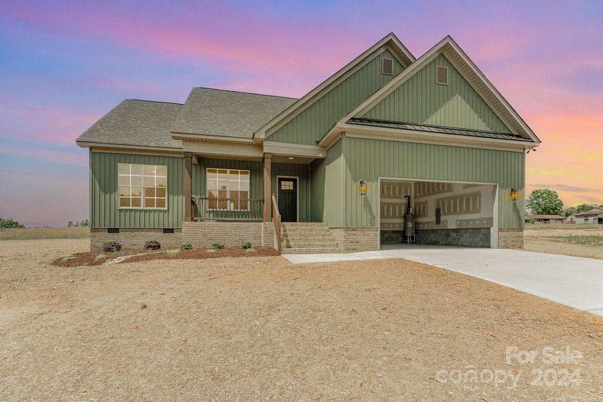 Welcome home to this quality new construction on nearly a 1.5 ACRE lot!  Come see what this open 1-story floor plan has to offer!  3 bed/2 bath and 2 car garage is ready for its new owner and NO HOA!  The kitchen boasts white Samsung appliances, granite countertops and gorgeous tile backsplash. Dining area overlooks the private back yard. The living room is open with vaulted ceilings! Primary bedroom features tray ceiling, large walk in closet and primary bath with dual sinks and tile shower with bench seating. Covered front porch and deck in the rear of the home.  Conveniently located near Statesville & Mocksville! Garage door to be installed in a few weeks.