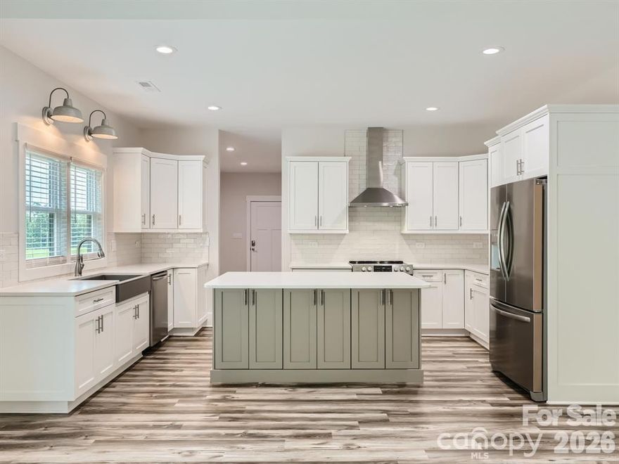 This stunning farmhouse retreat situated on a 1.71-acre private estate (including a 0.134-acre right-of-way) IS MOVE IN READY!! Backed by lush, wooded grounds is designed for both elegance and comfort, offering a gracious southern-style front porch which welcomes you into the heart of the home. A seamless layout and chef’s kitchen showcases a striking quartz island, custom shaker cabinetry, stainless steel appliances, farmhouse sink, and plenty of prep and storage space. This 1 story F.R.O.G. split bedroom plan offers a private sanctuary owner’s suite with his/her custom closets, complemented by a spa-inspired bath featuring heated tile flooring, a luxurious soaking tub, an expansive walk-in shower, and dual vanity. With direct access to the deck, wake up to serene backyard views. Generously sized secondary bedrooms provide comfort and flexibility. Additional highlights include a versatile spacious bonus room over the garage, ideal for a home office, gym, or guest suite, as well as a walk-in attic. A spacious laundry room with storage, a large mud room, and an oversized garage with storage options plus extra parking space for guests, or recreational vehicles. This home offers energy efficiency, with the temperature-controlled crawl space, large enough for additional storage. A newly added eco-friendly 3-stage water filtration system, providing pure, clean water for a healthier lifestyle. Outdoors, enjoy a landscaped oasis with thoughtfully designed privacy plantings. Evenings on your large deck for casual entertaining under the stars. The Low-Maintenance Exterior features James Hardie® Fiber Cement siding that ensures timeless curb appeal with minimal upkeep. This home offers the best of both worlds: the serenity of a private wooded lot with the convenience of being close to shopping, dining, and Lake Norman amenities. Whether entertaining friends, raising a family, or simply savoring quiet evenings, this home is designed to fit your lifestyle.