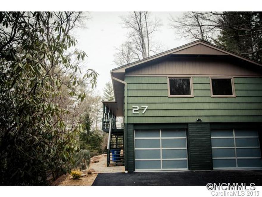 Beautifully remodeled mid-century modern rancher in desirable North Asheville neighborhood.  Interior features an open floor plan with two sided fireplace and mountain views from the living room. The kitchen has marble counter tops, stainless steel appliances and is perfect for entertaining!  The gleaming hardwood floors and modern touches are a must see. Everything is new, landscaping is done.  Just move in and enjoy the view!