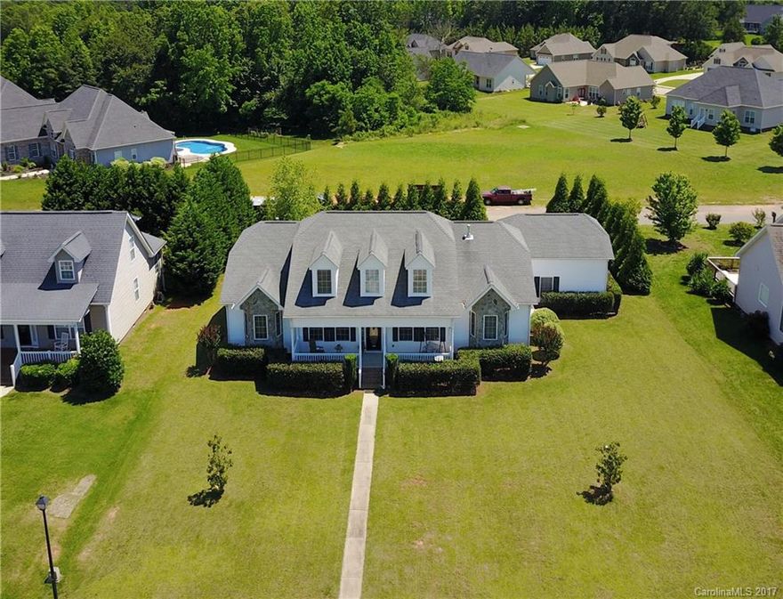 Wow! This beautiful custom-built home is located in the well desired Lakes at StoneRidge community; conveniently nearby York Preparatory Academy. W/ an open floor plan it has wood floors, master suite w/ tray ceiling, an office, 2 more bedrooms, large open great room, dining room, kitchen w/ lots of cabinet & counter space, laundry on the main level and 1 BR/1Ba w/ a bonus upstairs. A large front porch and a 21' X 12' deck in the back w/ matured privacy trees. Hurry, this won't last on the mkt!