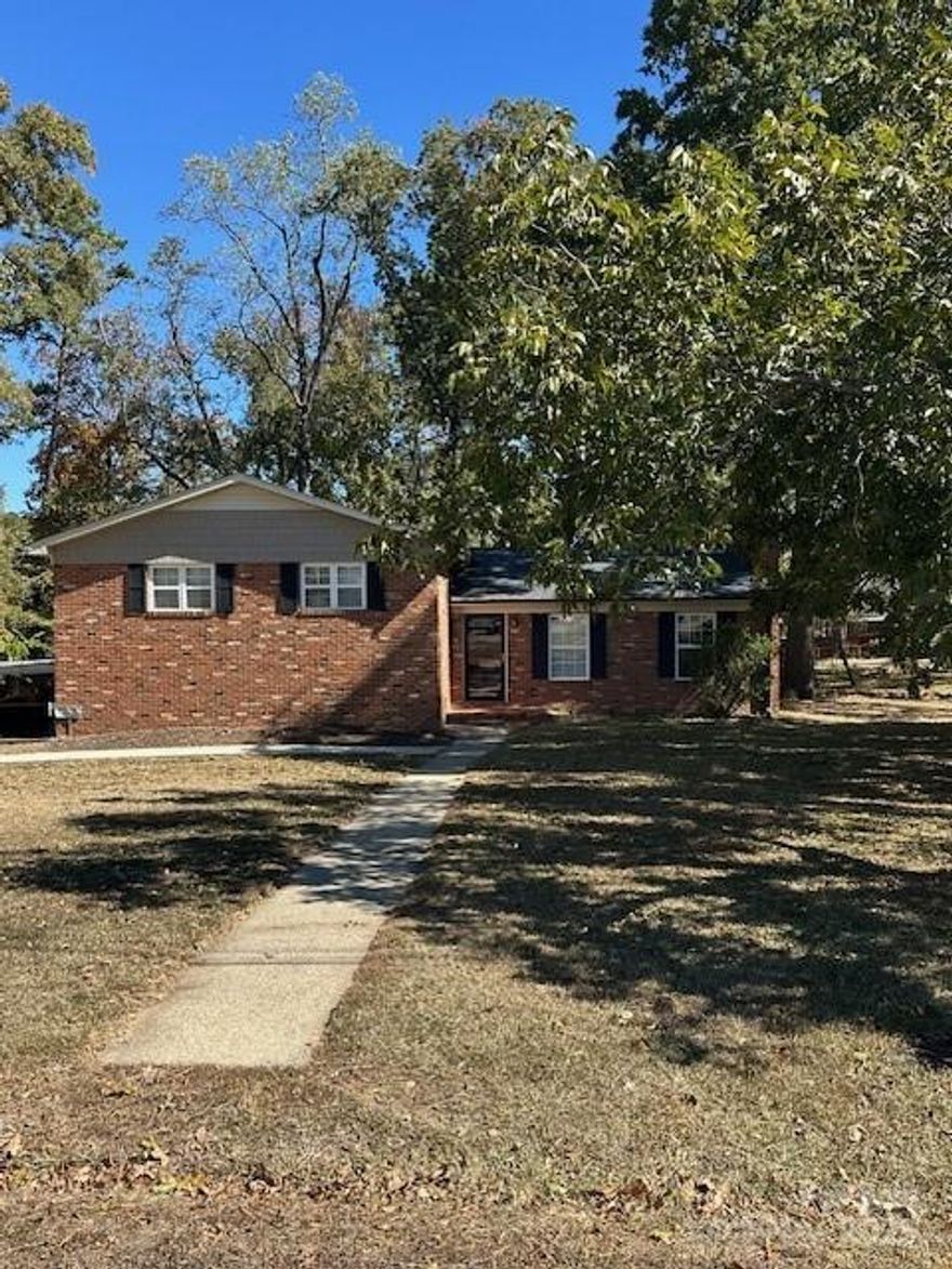 WELCOME to this lovely, well maintained ALL BRICK home on a beautiful lot, fully finished basement that could easily be used as an apartment if one should desire!  Like NEW appliances which ALL convey with exception of washer/dryer in basement laundry room.  Cook glass stovetop has a convenient air fryer option to eliminate messy kitchen frying endeavors!  The ROOF, which are architectural shingles is only approximately 3-4 years old according to previous owners relaying this to present owner which will give new buyer peace of mind to know that a very big part of usual an updating maintenance is already taken care of.  The Living Room does host a warm and toasty woodburning stove for the FALL and WINTER months approaching.  Window treatment hardware will remain but all drapes will not convey.  This traditional tri-story home gives one the impression it's much more spacious than it actually is with its open floor plan on the main level.  In the living areas you'll have a mixture of ceramic tile, carpet and hardwood flooring options in this home. All bedrooms have hardwood flooring. Primary bedroom has its own private full bath, and full bath downstairs in basement has updated sink/faucet, the basement would accommodate a bar/entertainment area easily, den, playroom or office; the choices are endless with this fully finished basement!  NEWER ROOF, NEW ELECTRIC WATER HEATER was just installed (2025) for great peace of mind for the new buyer!  THE ENTIRE CRAWLSPACE IS ENCAPSULATED WITH PLASTIC VAPOR BARRIER!!  There is a security system in place but occupant of home nor Sellers have ever activated the system with a company to have monitored. This home is located only minutes from downtown Concord...don't miss out on this gem, get your buyers settled in this traditional, cozy tri-level home before winter sets in.  Home will be professional measured the 1st week of November and sketches will be uploaded in attachments for your convenience!  Attic not accessible by stairs-access entry through space in primary bedroom closet only.   NOTE: Please allow a 2-hour notice when making an appointment with showing service to see the home...we appreciate it and thanks for showing!!