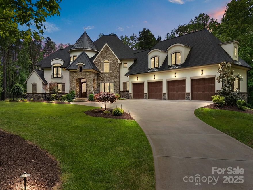 This Arthur Rutenberg home offers tranquility and exclusivity. With over 6000 sqft, this custom-built home features 6 beds and 6.5 baths. The main level features a chef's kitchen, which includes dual dishwashers, Thermador refrigeration, and a double oven with 6 gas burners, a primary suite and mudroom. Entertain with a stunning glass wine cellar, wraparound wet bar on the main level and upstairs Club Room. Have an immersive cinematic experience in the media room, enjoy a dedicated home gym with AC, which can also serve as garage space. This property prioritizes comfort and security with whole-house reverse osmosis and water softener systems, generator, and  "Control 4" smart home features for seamless technology integration. Outside, a private oasis: in-ground saltwater pool, jacuzzi and waterfall, a covered porch with a built-in grill, fireplace, and a firepit. The 10-car garage bays accommodate up to 12 vehicles with two hydraulic lifts. Lifestyle of privacy and luxury!