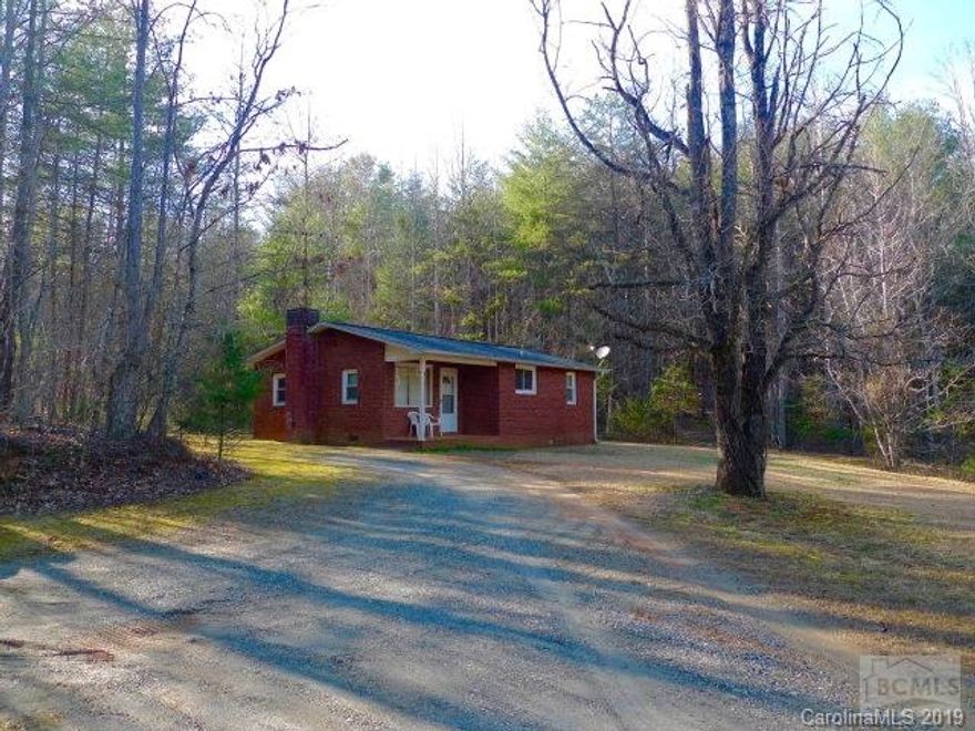 Brick ranch on 5 acres of private, wooded property.  Covered front porch, large living room, 2 bedrooms with hall bath.  Quiet and peaceful and just minutes to Lake James for fishing and boating.