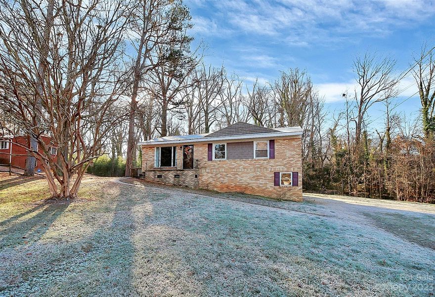 Welcome home to this charming 4 bedroom home located in the heart of Spencer! This home has it all, plenty of space, a tree-lined backyard, fireplace and more! When you walk in, you're greeted by the open living room and kitchen which has serene views of the backyard. Direct access to the basement and outdoor deck is located in the kitchen. The main level offers 3 bedrooms with one and a half bathrooms, while the large basement has an additional bedroom and laundry. Transform the downstairs bedroom into a guest suite or office! Basement fireplace is in need of a gas line and insert. Enjoy the outdoor deck during spring, summer and fall! This home is located directly across the street from the Forest-Dale Club, Inc. private swimming pool. Enjoy the summer here or take a mile drive to the N.C. Transportation Museum. Home is located under 1 mile from North Rowan Elementary, Middle and High School! Walking distance to a Food Lion. Schedule a tour today and make this home yours!