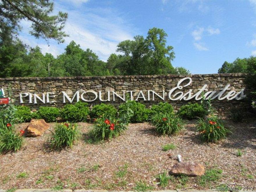 This gorgeous two-story townhouse, nestled in the gated community of Pine Mountain Estates, has it all! The 3 bedroom, 2.5 bath home has been beautifully updated, including a fantastic kitchen with custom hickory cabinets, a metal roof that is only two years old, and a large screened-in deck that overlooks the wooded hillside. Home also features carpeted bedrooms, a separate laundry room, and updated vanities in the bathrooms. Enjoy the beautiful golf course, hiking in the South Mountain State Park next door, or sitting on your custom deck, listening to the creek! This home is perfect for a permanent residence, or a weekend getaway. All appliances stay with the home. POA $374 Quarterly dues include water, sewer, and trash collection.