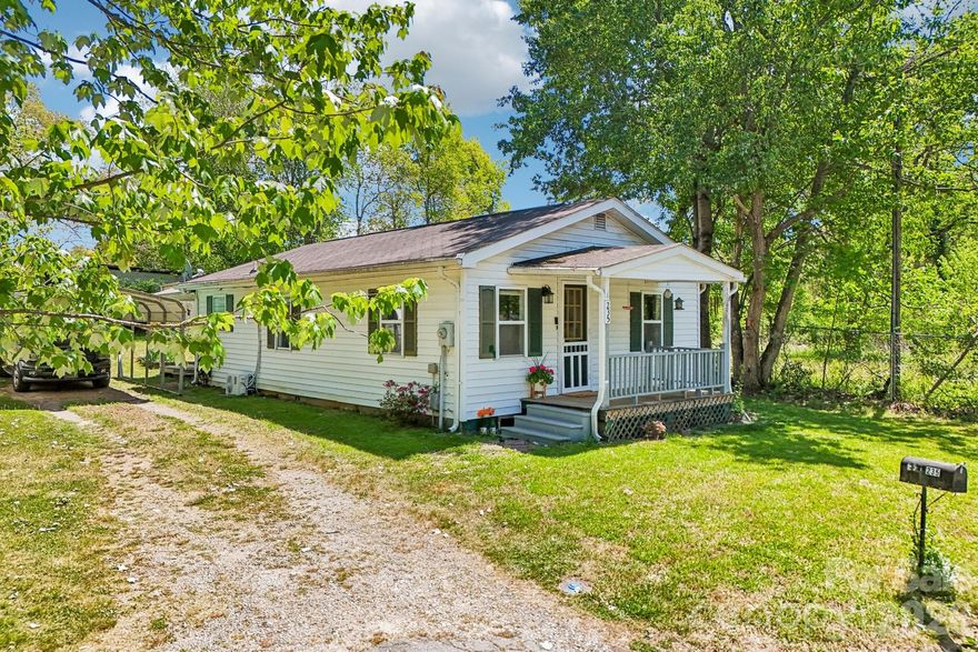 Cozy cottage just 10 minutes from downtown Hendersonville with I-26 access only 3 minutes away. Two bedrooms, one bath… idyllic and perfect for first-time buyers, downsizers, investors seeking a rental opportunity, or anyone wanting an easy lifestyle. Situated on a .26-acre lot, this adorable white cottage offers 824 sq ft of comfortable living space with thoughtful updates throughout in an area poised to continue growing in value.

Inside, you'll find a spacious kitchen with a breakfast bar and a charming corner coffee station. Beautiful refinished hardwood floors warm the main living area, while the bedrooms feature new LVP flooring and a giant built-in closet for added storage. The roomy bathroom includes a tucked-away washer/dryer closet for convenience. Recent upgrades include a brand-new mini split system—noted by the seller as a big energy saver, a 5-year-old 50-gallon Bradford White Hydrojet water heater, plus new insulation in the attic.

Step outside to the covered back deck—sit and enjoy the quiet sound of the birds, have your morning coffee or a glass of wine. It could easily be screened in for even more enjoyment. The backyard also features a well-built workshop perfect for hobbyists, studio space, she-shed, or future tiny home potential, plus a second tool shed and carport. Seller says neighbors are very friendly and look out for one another. A wonderful opportunity in a fantastic location! Schedule your showing today—this one won't last long!