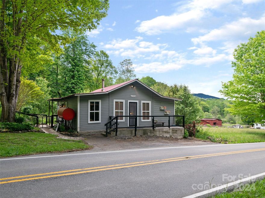 Don't judge her because she is small. Known as "Sadie", she offers everything needed for that little mountain getaway of which you have been dreaming. She comes with a spacious living room and dining area, a lovely kitchen with all of the modern conveniences, a large bathroom, and laundry/storage room. Two additional rooms are used for sleeping quarters, and there's a small room currently being used as a playroom but would also be perfect for a small office. There is minimal upkeep needed outside with a small yard and beautiful flower gardens. Open the windows and the doors to hear the roar of the Big Rock Creek, located just across the road. Affordably priced for the summer.