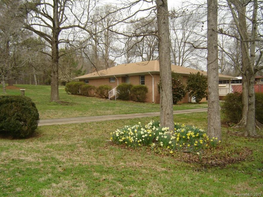Great opportunity for a home makeover on this 3 br brick ranch on almost one acre. The exterior has been
freshly painted in 2014 and the roof was replaced in 2011.  Formal Living room, dining, den opens to kitchen.
Carport, Storage building. Convenient to I-485 , Airport and downtown.  Nice established neighborhood
 House to be sold "as is".