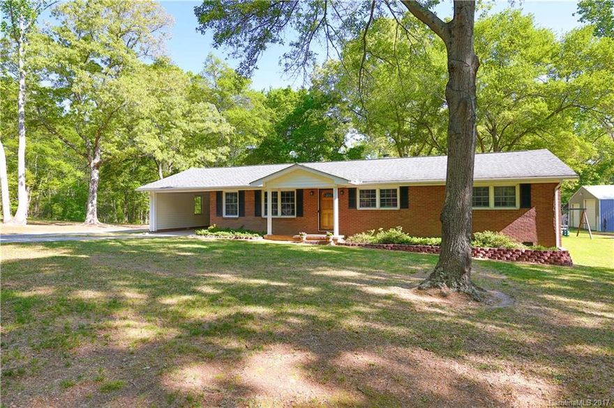 This isn't just any old brick ranch. Sure, it's got 3 beds, 2 full baths, over 1600 sq ft, and both formal living and dining rooms. But it's also got superb updates, a spacious kitchen, a master bathroom picked right out of a magazine, and a perfect patio for soaking in the sun. AND...it's got a jaw-dropping 7.3 acres almost fully landscaped with a stocked pond! You'll never run out of fun things to do, especially with a 40X40 workshop with a car lift! Grab your fishing pole and see it today!