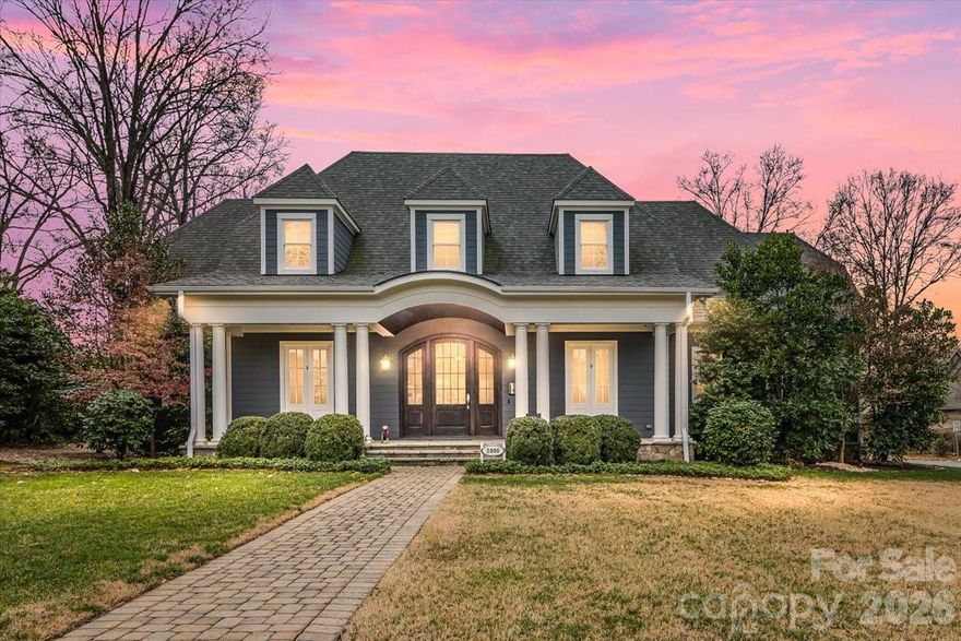 Elegance in Old Foxcroft! This custom-built home, designed by Christopher Phelps, sits on a .42-acre corner lot in the heart of Old Foxcroft. A large covered front porch welcomes you with custom doors, flagstone pavers, and a striking barrel ceiling.  Inside, the open floor plan offers exceptional detail and conveniences throughout. The  gourmet Kitchen features custom cabinetry, a large island with Cambria countertops, bar seating, and glass pendants. Addt'l highlights include a Thermador 6-burner gas range with double ovens, warming drawer, custom hood, Thermador dishwasher & refrigerator and a wine storage room.  The adjacent Scullery makes hosting effortless, offering pantry storage, a copper sink, microwave, and a second dishwasher. The Great Room showcases a coffered ceiling, gas fireplace with limestone mantel, and built-ins. The main-level Office or Flex room provides added versatility, along with a main-level Bedroom featuring an en suite Bath with a wheelchair-accessible, zero-entry shower.  The Resource room includes a built-in project/art table, desk, galvanized tub sink, drop zone, and serves as level laundry room. Upstairs, the Primary suite and three additional Bedrooms all feature en suite Baths. The Bonus room offers a wet bar with beverage refrigerator, while a second Laundry Room provides walk-in attic storage. The children’s Study includes built-in desks and a charming window seat.  Outdoor living is a dream, with a 563 sq ft three-season porch featuring EZE-Breeze windows, a gas fireplace, and a built-in Wolf gas grill. The backyard continues to impress with a built-in EVO grill, Yoder pellet smoker, and a private putting green—perfect for relaxing after a long day.  The list of upgrades goes ON and ON! This exceptional home truly has it all and is just steps from SouthPark shopping and dining.