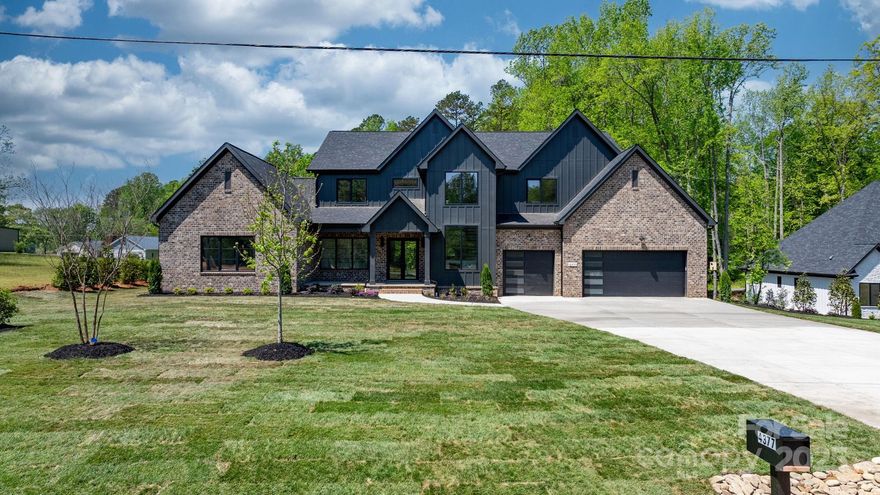 This 5,692 sqft masterpiece sits on 1.09 acres with partial lake views and showcases European-style windows throughout. Featuring 4 spacious bedrooms, 6 full baths, an elegant office, and a versatile flex room, this home is designed for luxury living. The gourmet kitchen is a chef’s dream, complete with a scullery and premium finishes. Enjoy the convenience of two laundry rooms—one on each level. The expansive open floor plan leads to a screened porch, perfect for entertaining or relaxing in privacy. A 3-car garage adds the finishing touch to this thoughtfully crafted residence. Every detail reflects quality, style, and sophistication. Rare opportunity in a prime location—schedule your private tour today!