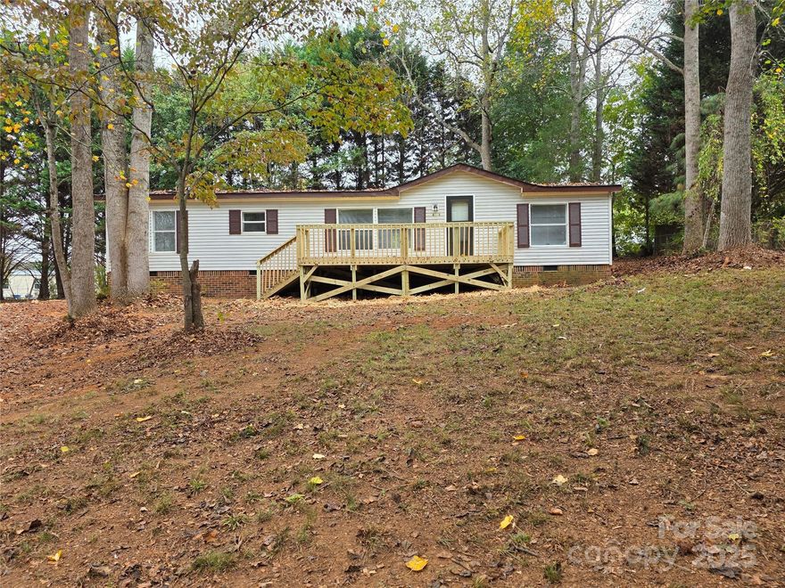 Stunning 3 Bedroom home! Large open kitchen new counter tops. New Stainless steel appliances. Formal dining room to entertain your family in. Fresh paint and new flooring throughout the home. Wood burning fireplace to sit and relax by. Large front and rear decks to entertain. New vanitys in the bathrooms with new counter tops