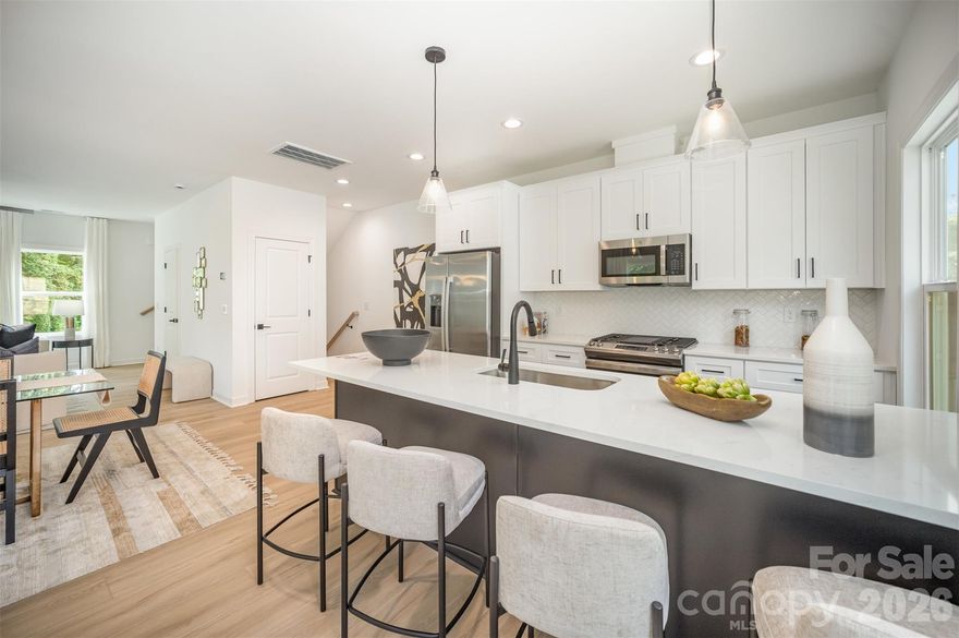 Stunning quality in this new construction townhome with a TWO CAR garage. Easy commute to and from Uptown Charlotte, Sound End, and Charlotte's west side. Be amazed at the level of finishes at this price! High end construction with no detail left undone. Beautiful quartz countertops, LVP flooring, shaker style cabinets. Upgraded plumbing and lighting fixtures throughout accentuate each room. Stainless steel appliance package with fridge included. Come discover Westerly Hills- a growing pocket of Charlotte’s West side where new construction and commercial developments are plentiful. This home qualifies for a special loan program with up to $20K in lender credits to be used toward a rate buy down, closing costs, or down payment. They offer up to 100% financing with no PMI. There are no rental restrictions in this community. HOA covers water, trash, lawn maintenance & common area maintenance.