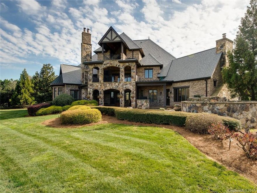 Located in ultra-exclusive estate section of LCC, this home boasts beautiful vistas of the 12th fairway, a serene lake, & quiet seclusion on a private cul-de-sac.  Two story, limestone fireplace accentuates the formal living room which opens to the kitchen & stately family room. Features include steam shower & dry sauna,elevator grants ease to 2nd floor. Unfinished 3rd floor w/beautiful views. Bedrooms 4 & 5 are above garages; one can also serve as a media room. Priced below tax value.