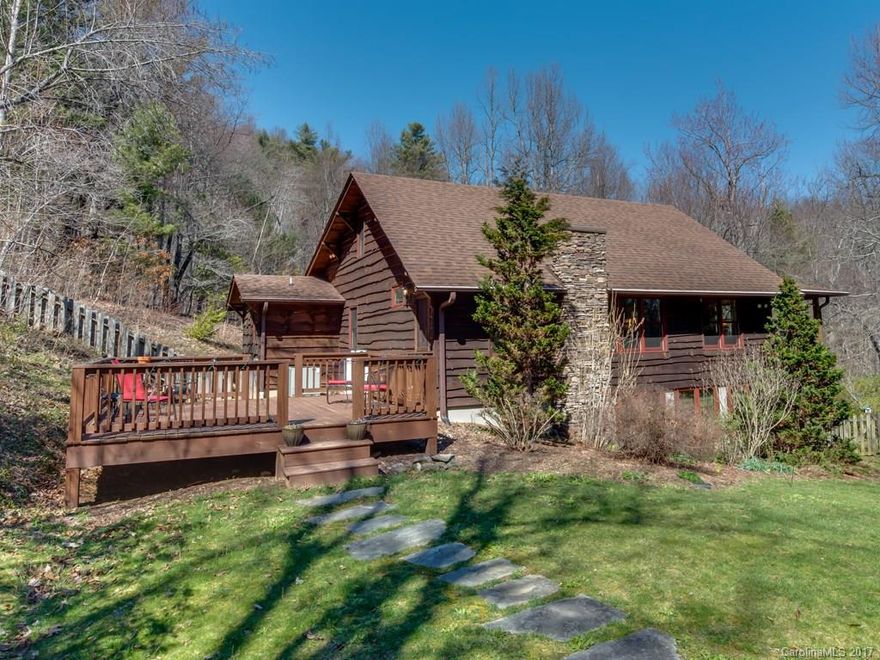 A perfect mountain retreat in a completely re-done cabin in the woods on 9 beautiful acres. Springs, pond, hardwoods and lush greenery.Outdoor entertainment area with stacked stone fireplace. New bathrooms and kitchen fixtures.All new 2-car garage with carport and heated space for office or studio. Less than 2 miles to downtown Saluda.